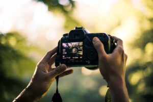 A photographer holding a camera.