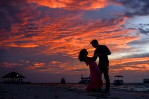 Couple on the beach at sunset